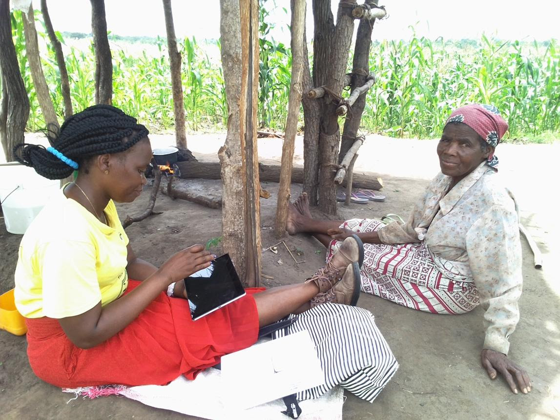 SustainLife field consultant collecting community data with a rural household in Tanzania